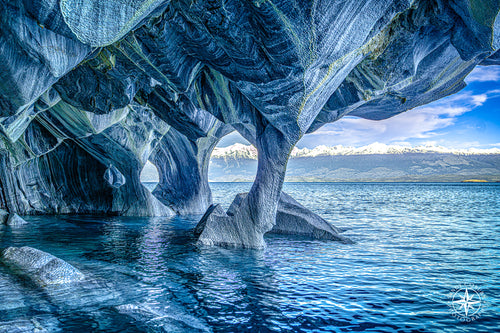Thin marble column supporting a massive cave ceiling above General Carrera Lake in Chilean Patagonia.