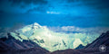 Mount Everest, called Chomolungma in Tibetan, emerges from behind clouds on the Himalayan Plateau in a quiet moment of revere